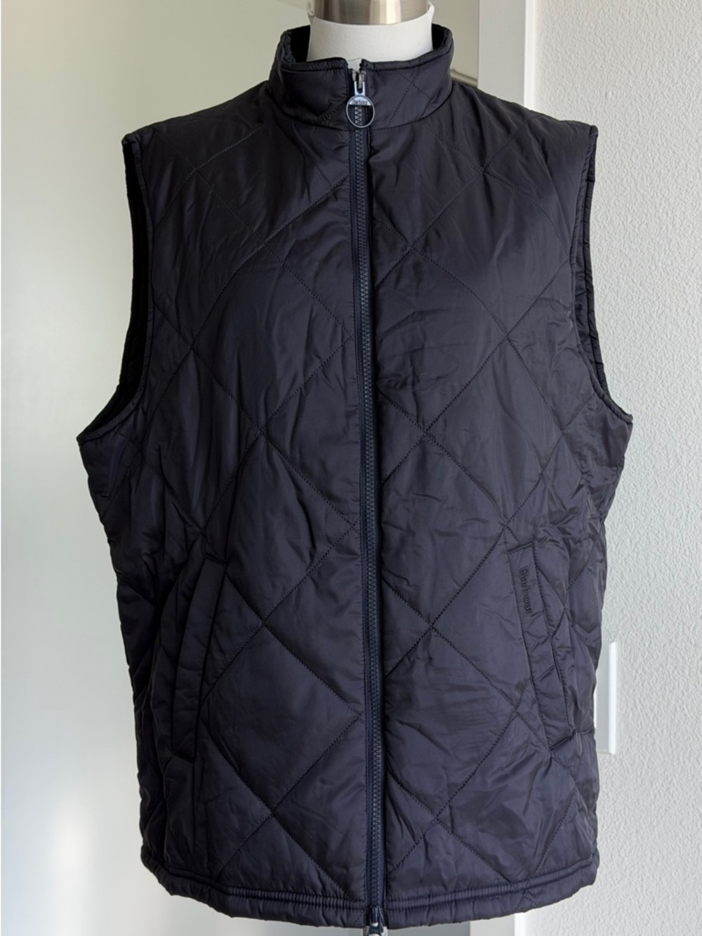 Barbour Finn 
Men's dark blue quilted vest with zipper size M